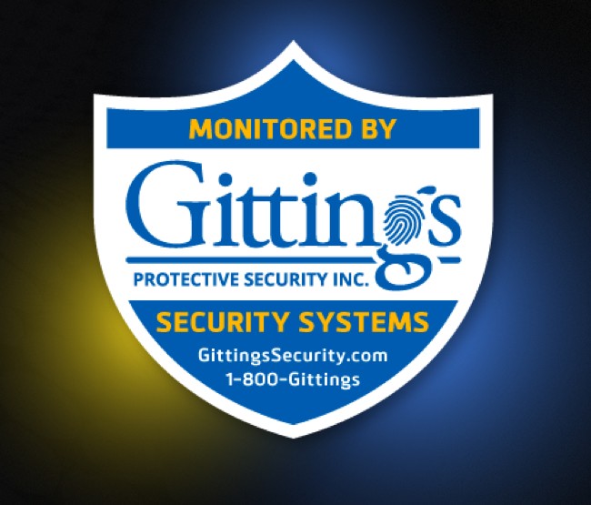 Monitored by Gittings Protective Security Inc. yard sign with security systems, GittingsSecurity.com, and 1-800-Gittings