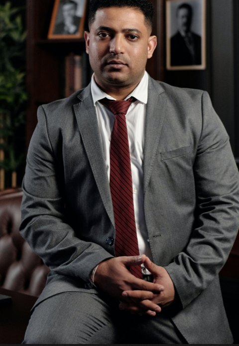 Professional investigator in a gray suit in an office