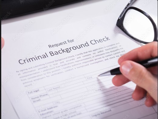 Request for Criminal Background Check form being filled out