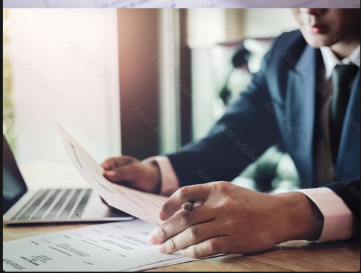 Investigator reviewing documents at a desk