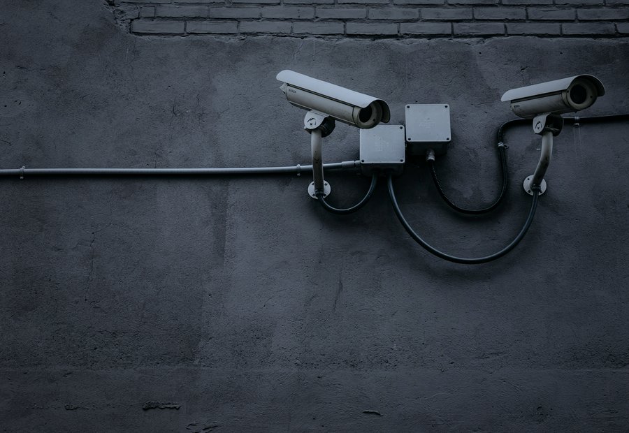 Person using a wall-mounted electronic security keypad